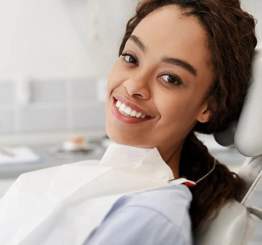 smiling woman sitting in dental chair